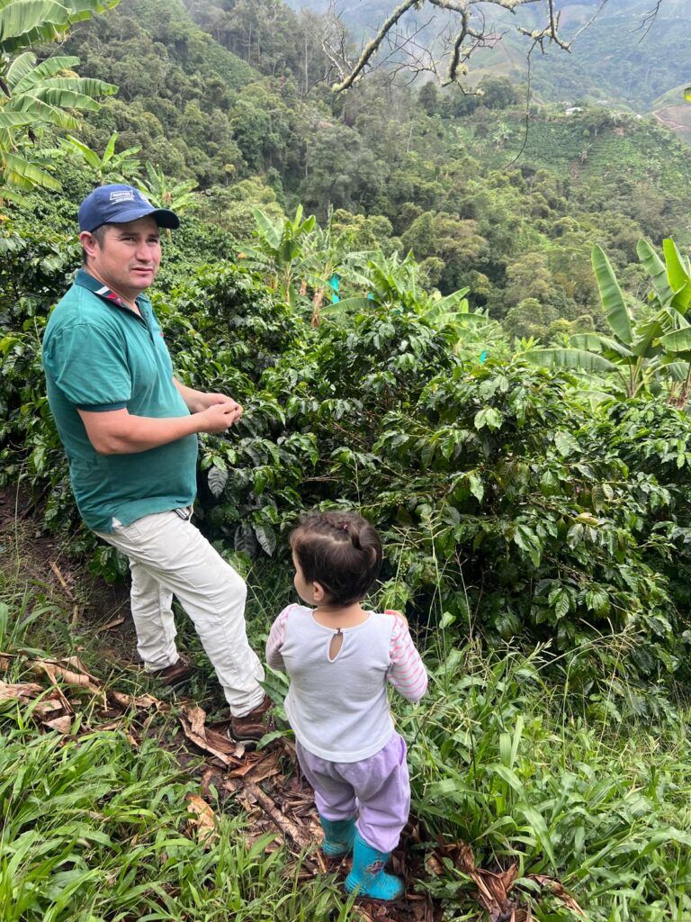 A photo showcasing a coffee farmer and his daughter on a coffee farm in Colombia, where one of the coffees for Durham Coffees Christmas Coffee Collection originates from. 